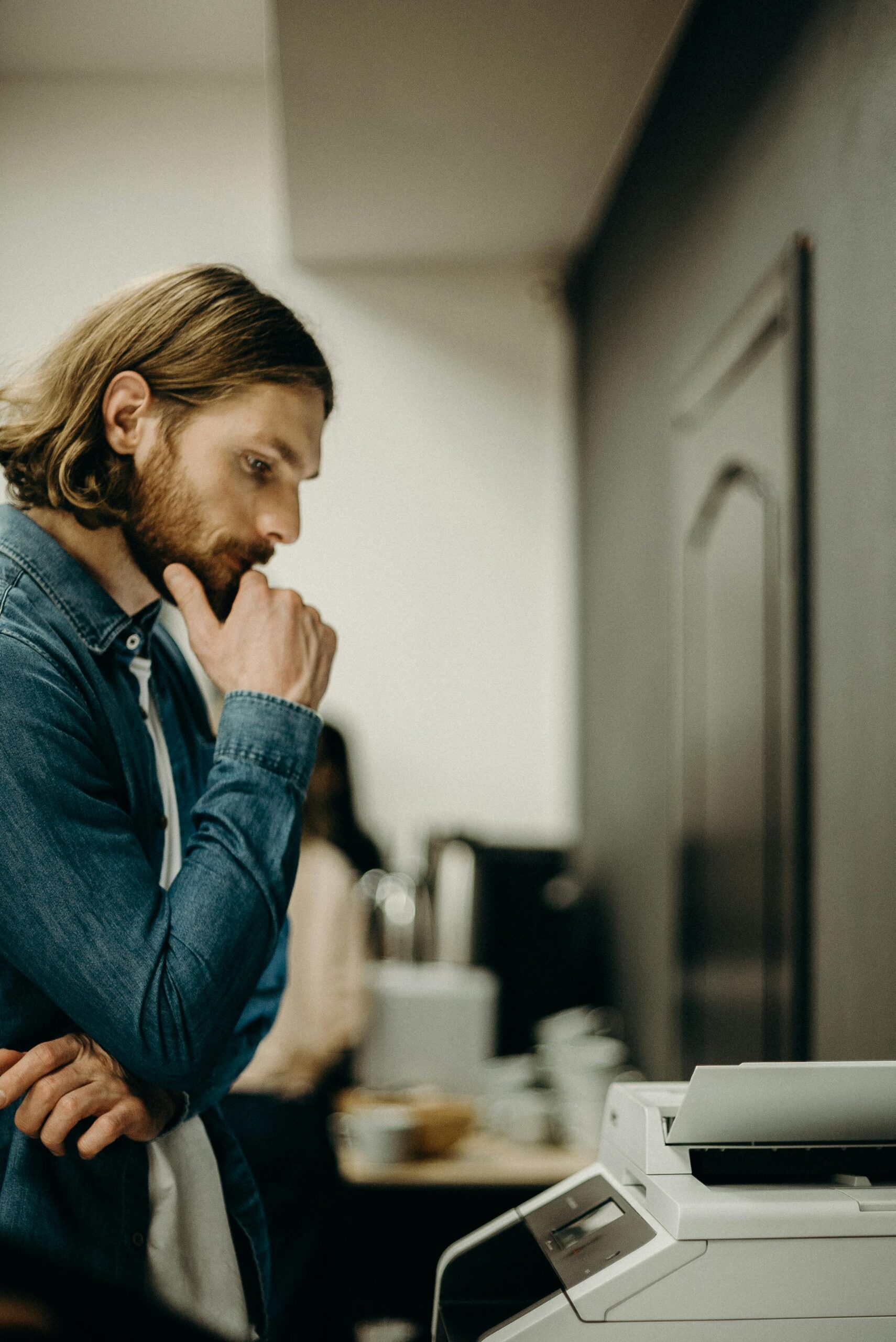 man looking at office technology